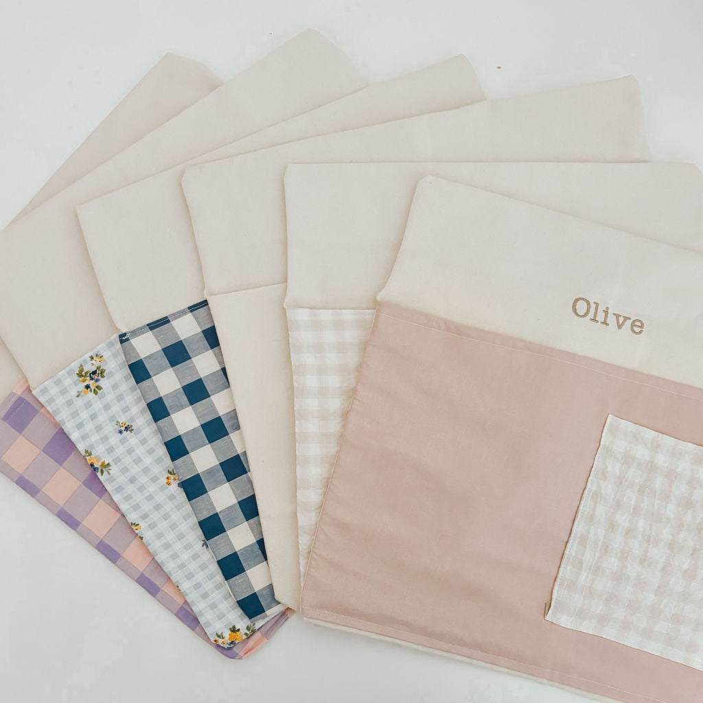 Personalised chair bags in various gingham patterns, showcasing a natural design and customization options.