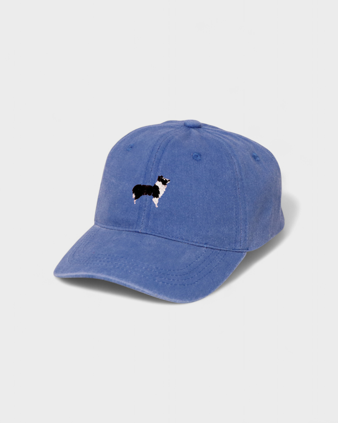 Border Collie personalised hat with embroidered design and customizable text on blue washed cotton fabric.
