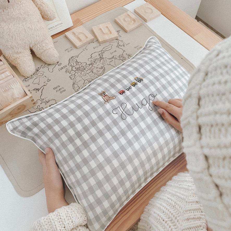 Choo Choo Train Linen Cushion with embroidered train and teddy design on a checkered background, personalized with name.