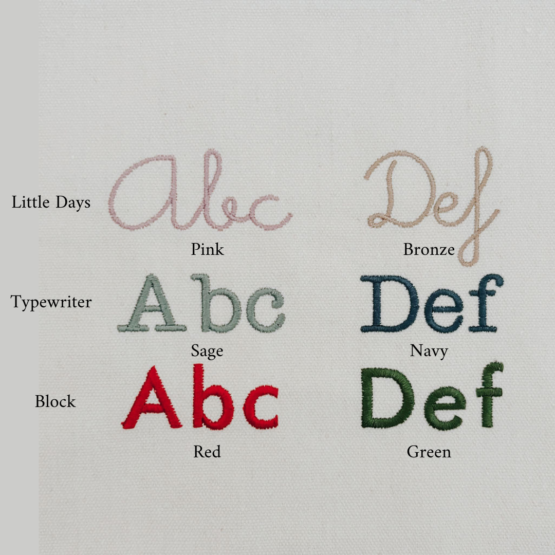 Embroidery font options for Personalised Chair Bag with Little Days, Typewriter, and Block styles in pink, bronze, navy, sage, red, and green.