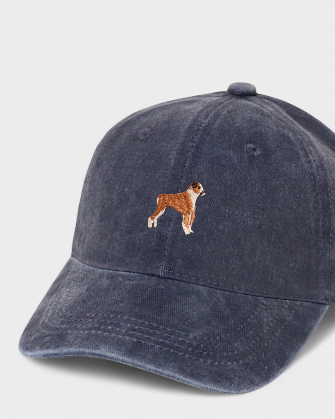 Navy washed cotton baseball cap with embroidered hand-drawn Boxer dog design, personalised embroidery option on back.