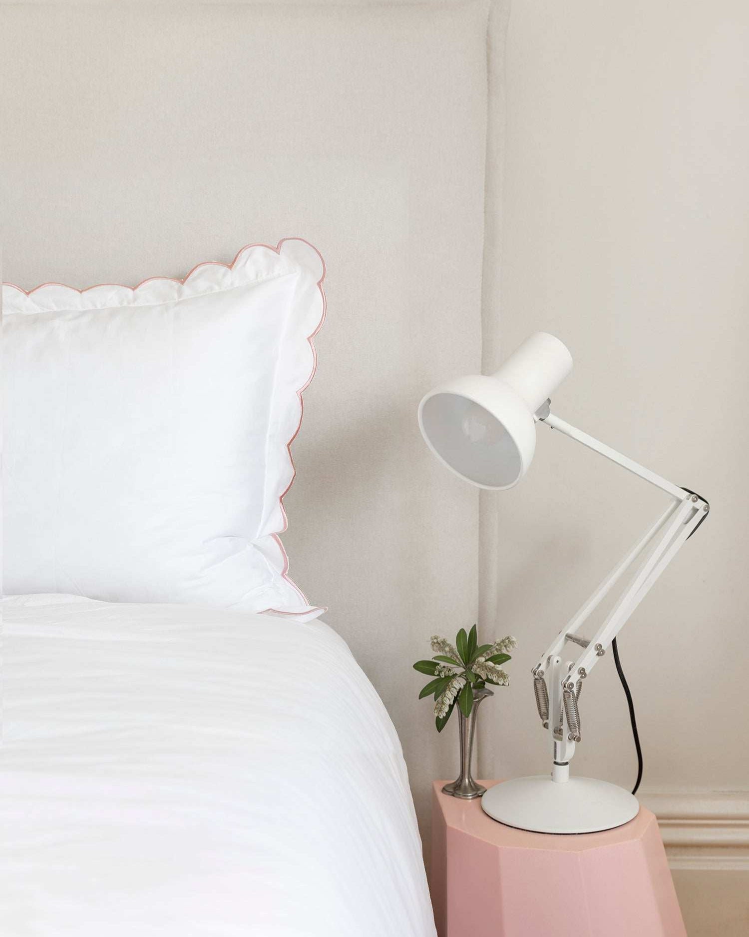 Organic cotton pillowcase with blush pink scalloped edge, ideal for toddlers.