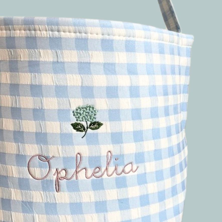 Personalised Easter Bucket with hand-drawn hydrangea embroidery on blue gingham design.