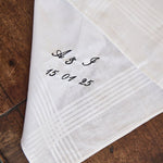 Personalized embroidered men's cotton handkerchief on wooden surface