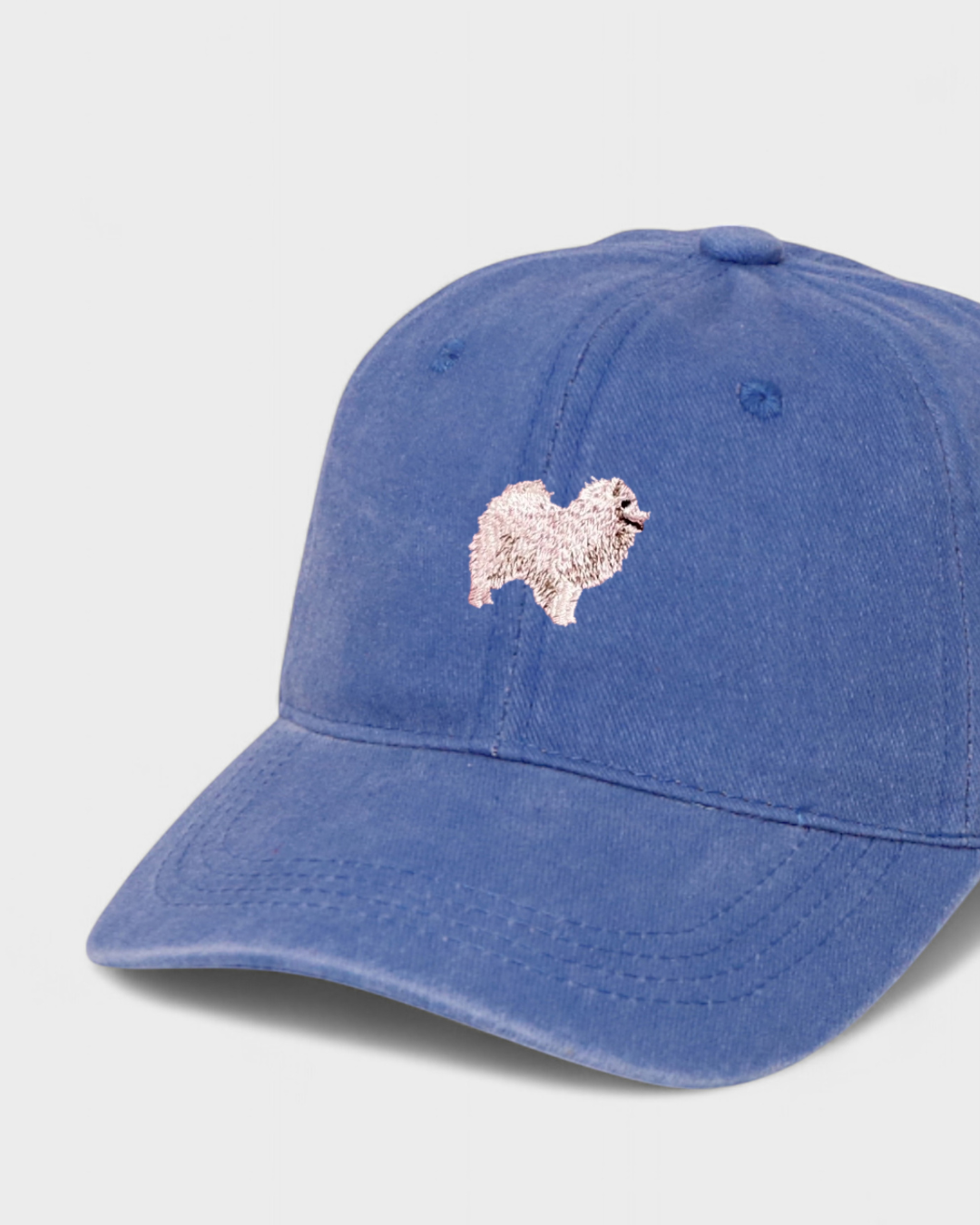 Japanese Spitz personalised hat with embroidered dog design on blue 100% washed cotton.