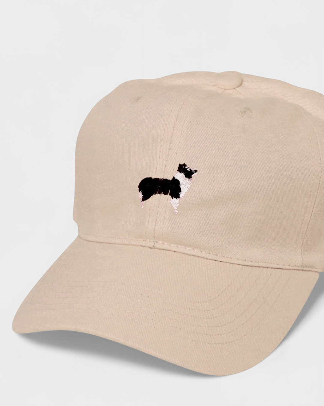 Border Collie personalised hat with embroidered dog design on front.
