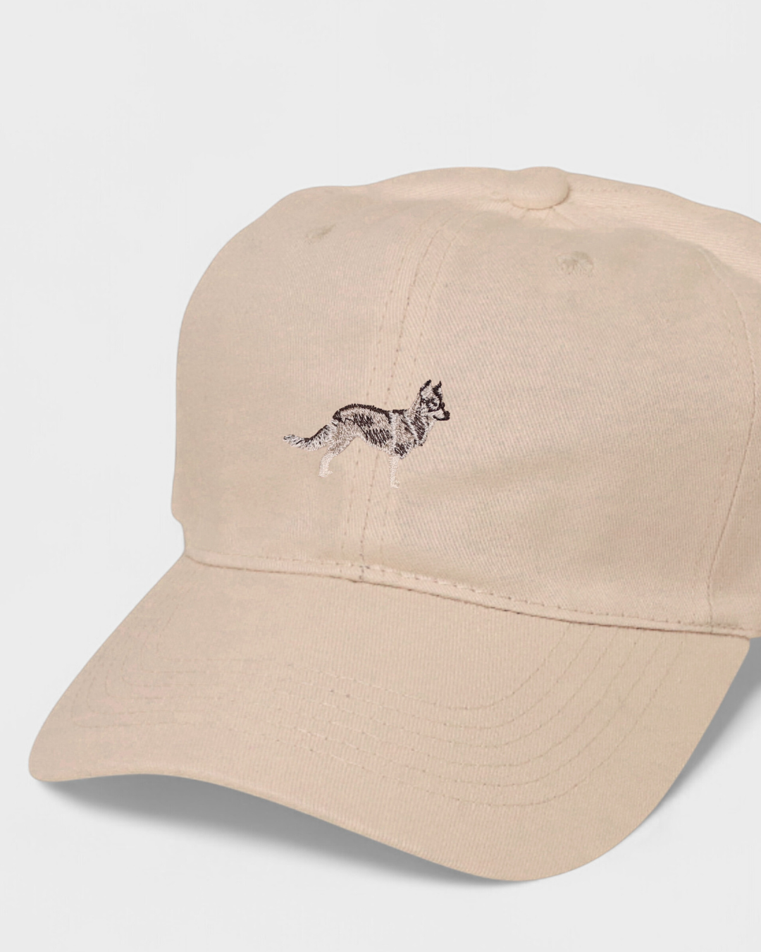 Husky personalised baseball hat with hand-drawn embroidered design on front.