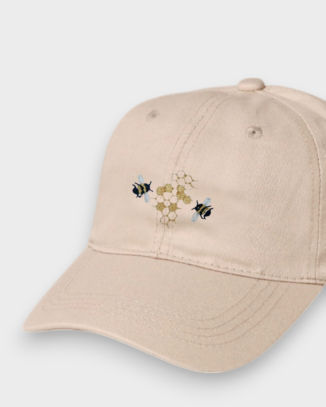 Bees personalised hat with embroidered bees and honeycomb design on beige baseball cap made of 100% washed cotton