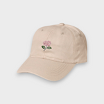 Beige personalised hat with hand-embroidered pink hydrangea design on front, made of 100% washed cotton with classic baseball fit