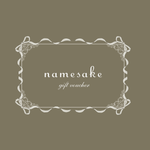 Namesake Gift Card with decorative border and ribbon design on a brown background