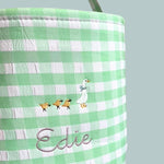 Personalised Easter Bucket with hand-drawn Mother Goose embroidery on green gingham pattern.