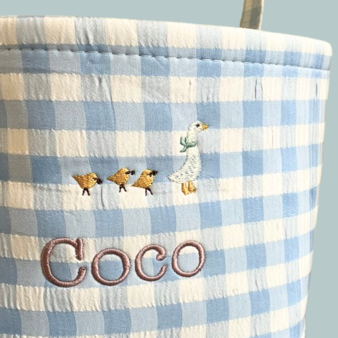 Personalised Easter Bucket with gingham pattern and hand-drawn goose embroidery design.