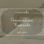 Namesake Gift Card for personalised keepsake gift voucher with vintage decorative frame on a bed background