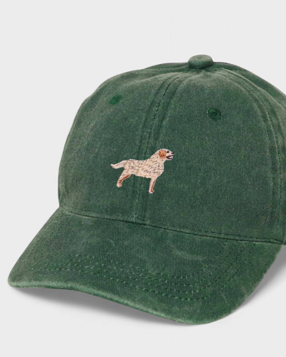 Green baseball cap featuring embroidered Golden Retriever design with customizable text, made of 100% washed cotton.