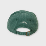 Green personalised baseball hat with custom embroidered name on back strap adjustment