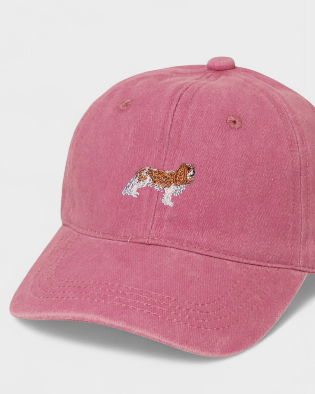 King Charles Spaniel embroidered pink baseball hat made of 100% washed cotton.