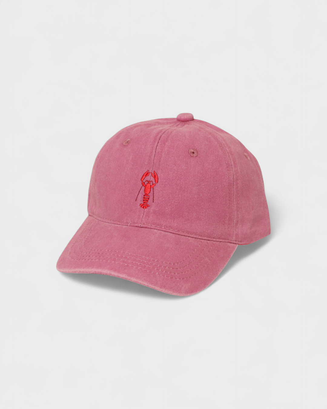 Pink washed cotton baseball cap with red lobster embroidery and personalised back embroidery option