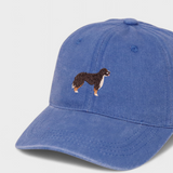 Blue baseball hat with embroidered Burmese Mountain Dog design on the front, made of 100% washed cotton, personalised embroidery option on the back.