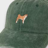 Green washed cotton baseball cap with embroidered Shiba Inu design on front, customizable with personalized embroidery on back