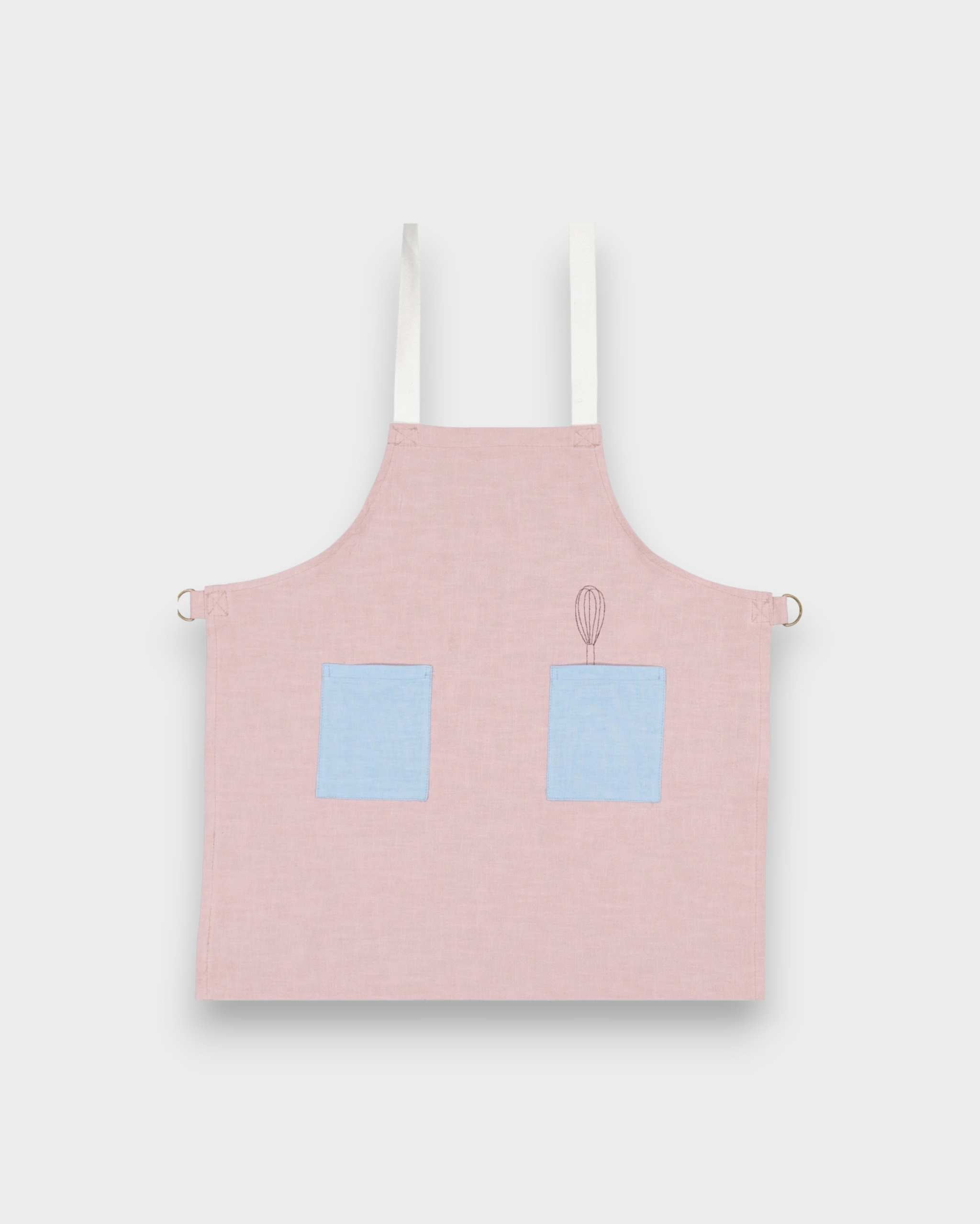 Kids pink linen apron with blue contrasting pockets and adjustable straps, suitable for ages 2-6.